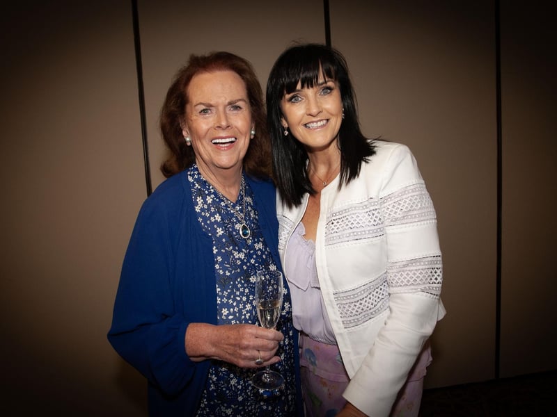 Úna is congratulated by one of her former pupils, Margaret Ross.