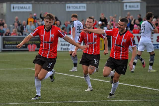 Will Patching (left) celebrates his winning goal, against Sligo Rovers, with Ben Doherty and Michael Duffy. Photo: George Sweeney. DER2327GS - 027