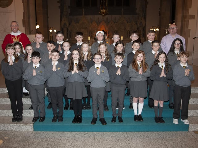 Pupils from Model Primary School who received the Sacrament of Confirmation from Fr. Paul Farren at St. Eugene’s Cathedral on Wednesday afternoon last. On right is Mr. Michael Bradley, Vice Principal. (Photo: Jim McCafferty Photography)