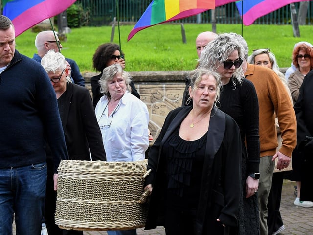 A wicker coffin, containing the remains of journalist and activist Nell McCafferty, is brought to the Long Tower Church for Requiem Mass on Friday afternoon.  Photo: George Sweeney