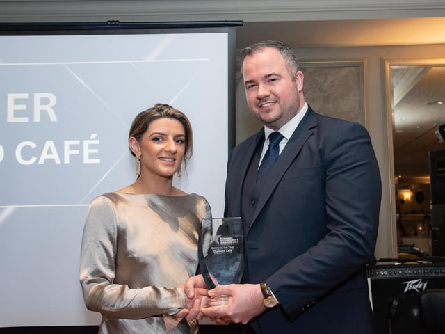 Eatery of the Year, Diamond Cafey's, Tanya McLaughlin collects the Buncrana Bottling sponsored award from Davin Doherty at the Carndonagh Traders Business and Community Awards in the Ballyliffin Lodge Hotel on Saturday night last. Photo Clive Wasson.