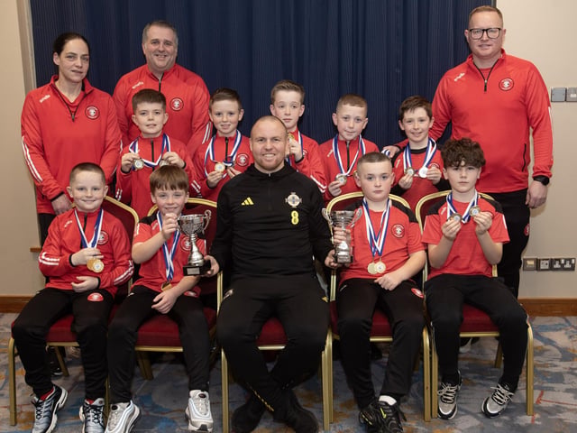 Ronan O'Donnell, Irish Football Association, special guest at the D&D Youth FA Annual Awards at the City Hotel on Friday night presents Tristar u-9s with the Summer and Winter Cups. Included are coaches Louise McClelland, Jonnie McDevitt and Peter Doherty.