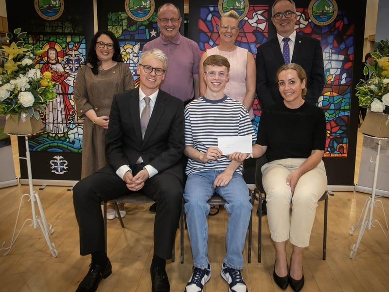 Ms. Maeve McGurk (award sponsor0, presenting the Paula McGurk Scholarship Award to Ben Crawley on Thursday evening. On left at front is Mr Brendan McGurk (Guest Speaker / Award Sponsor), and back from left are Mrs Caroline McLaughlin (Principal), Mr Martin Crawley, Mrs Donna Crawley (parents), and Mr Tony McGonigle (Senior Teacher). : .
