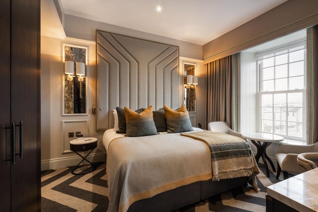 A room in the Ebrington Hotel Clock Tower building with a river view.