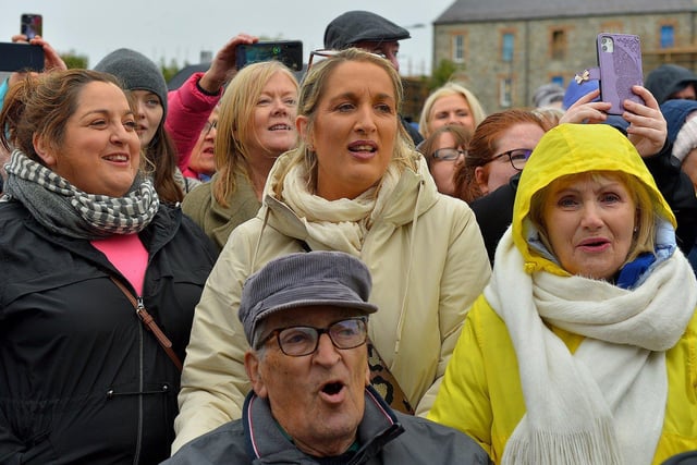 Some of the large attendance at Ebrington Square sing along during Phil Coulter’s  live performance of his iconic hit ‘The Town I Loved So Well' on Saturday afternoon last. Photo: George Sweeney.  DER2240GS – 17
