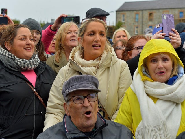 Some of the large attendance at Ebrington Square sing along during Phil Coulter’s live performance of his iconic hit ‘The Town I Loved So Well' on Saturday afternoon last. Photo: George Sweeney. DER2240GS – 17