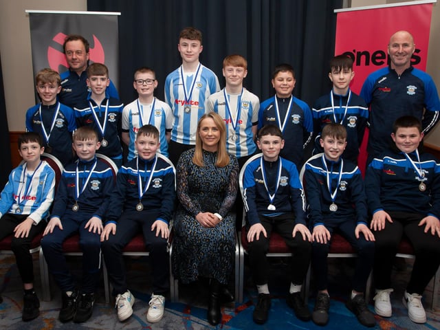 Caroline Casey, manager, O’Neills Sports Superstore, Derry pictured with Strabane AFC, League runners-up 2010, at the Annual Awards in the City Hotel on Friday night last. Included are coaches Marty McDaid and Scaldy Roulston. (Photo: Jim McCafferty)