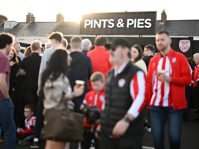 Supporters in front of a stall titled 'Pints & Pies' before the SSE Airtricity Men's Premier Division match between Derry City and Shamrock Rovers at Find Insurance Celtic Park in Derry. Photo by Stephen McCarthy/Sportsfile