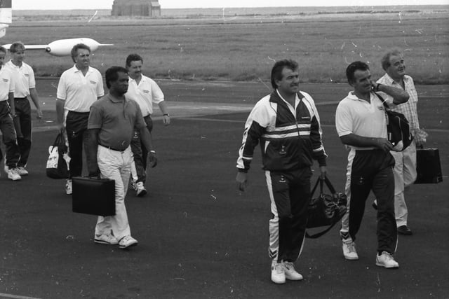 Terry Venables and the Spurs backroom staff march up the apron at Eglinton