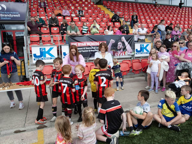 Phoenix Athletic FC players receive their medals at the Ryan McBride Brandywell Stadium on Wednesday.
