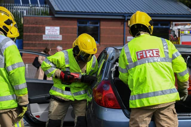 Firefighters take part in a road traffic collision demonstration during the launch of the Department for Infrastructure’s Road Safety Strategy for Northern Ireland to 2030 and the 2024/2025 Action Plan at the NIFRS western area headquarters on Crescent Link on Thursday afternoon. Photo: George Sweeney