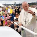 Pope Francis waves to the faithfull as he arrives to lead the Holy Mass at Phoenix Park in Dublin on August 26, 2018, during his visit to Ireland to attend the 2018 World Meeting of Families. (Photo by Ben STANSALL / AFP)        (Photo credit should read BEN STANSALL/AFP via Getty Images)
