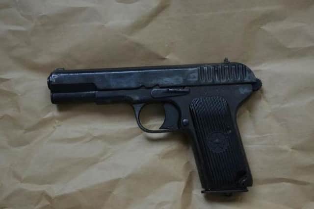 A gun recovered during the searches.