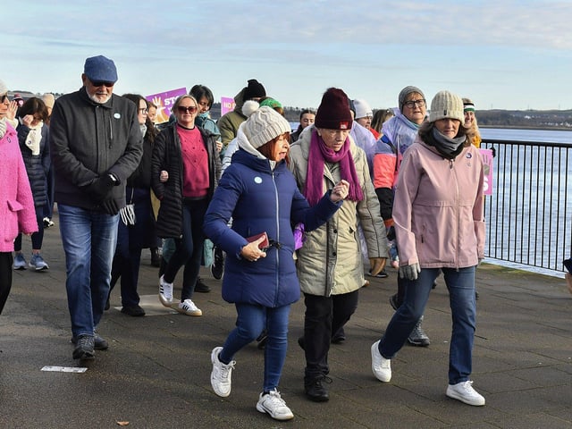 Proponents who participated in the Foyle Women’s Aid walk, from Sainsbury’s to the Guildhall on Sunday afternoon, supporting the United Nations Women’s Campaign to eliminate gender – based violence worldwide. Photo: George Sweeney