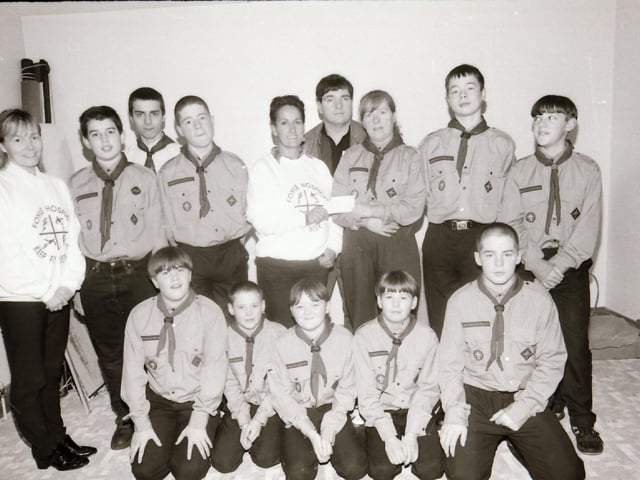 Scouts presenting a cheque to Foyle Hospice.