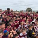 Slaughtneil players and supporters celebrate their Derry senior hurling victory at Owenbeg.