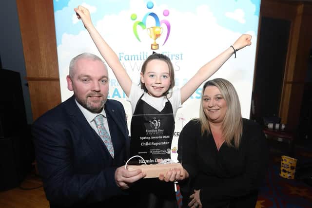 Seven year old Yazmin Doherty is pictured with her highly-deserved award at the Titanic Exhibition Centre. Dad Gerard says he and wife Nichola are 'very proud' of their daughter, who came up with the idea for the Toy Appeal aged just three years old.