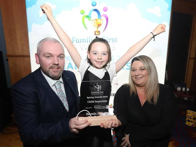 Seven year old Yazmin Doherty is pictured with her highly-deserved award at the Titanic Exhibition Centre. Dad Gerard says he and wife Nichola are 'very proud' of their daughter, who came up with the idea for the Toy Appeal aged just three years old.