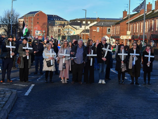 Relatives pause at the Bloody Sunday monument, on Rossville Street, during the annual Bloody Sunday march. Photo: George Sweeney