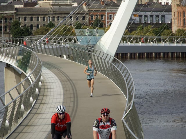 Kyle Doherty is some way ahead of the pack towards the finish line as he crosses the Peace Bridge in this photograph.
