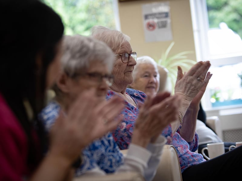 Residents at the Creggan Day Centre joining in with the Ulster Orchestra who performed at the centre on Tuesday morning last as part of Féile 24.