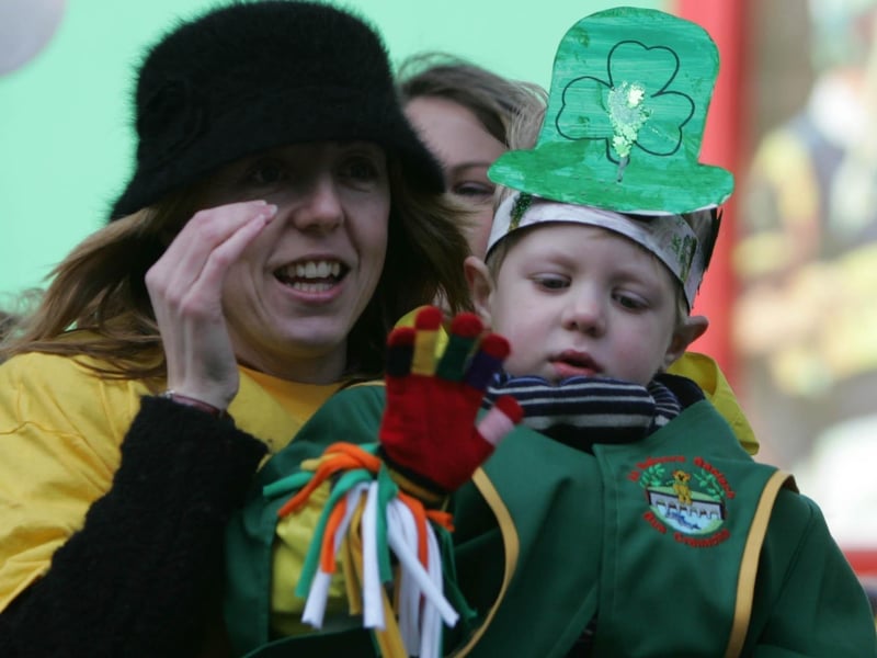 This lady on one of the floats at the St. Patrick's Day parade in Buncrana is a little shy infron oft he camera. (2103JB34) : St Patrick's Day in Buncrana in 2006