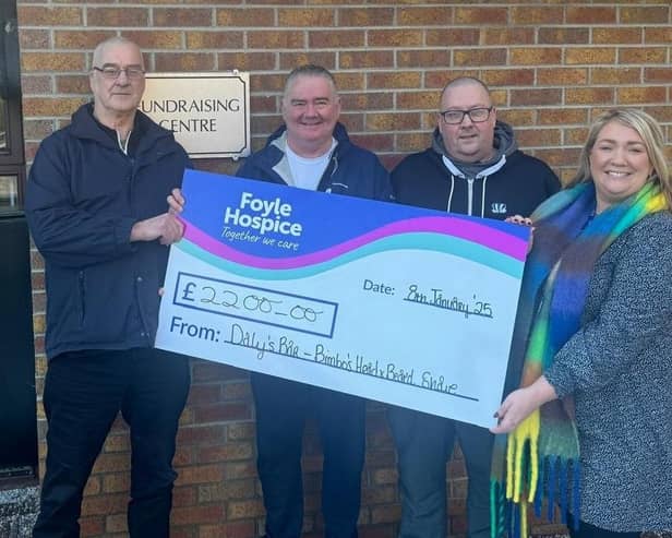 Pictured are Bimbo Boyle, Paul Young and Kieran Bradley, Daly's Bar & Bistro presenting a cheque for £2,200 to Foyle Hospice Community Fundraiser, Ailbhe McDaid, proceeds from Bimbo's head and beard shave.