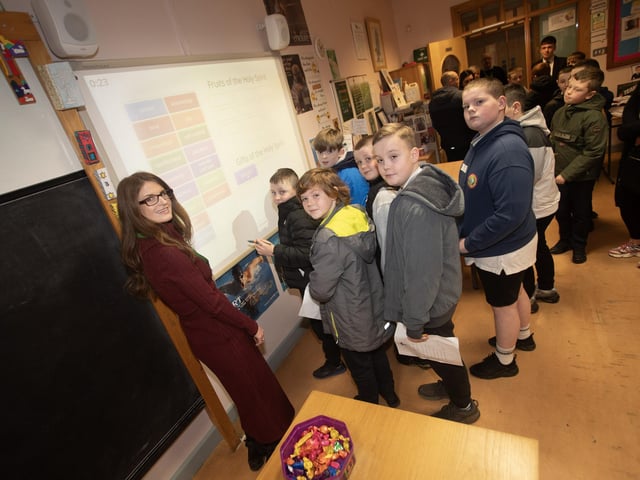 RE teacher Mrs. Catherine Logan pictured with pupils from Sacred Heart PS.