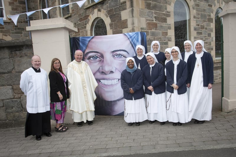 Bishop Donal McKeown, Shauna Crockett and Fr. Gerard Mongan pictured with some of the Carmelite nuns who attended Sunday’s Mass at the Long Tower Church.