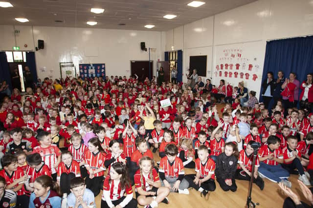 Steelstown Primary School pupils enjoying the visit of Derry City trio Shane and Patrick McEleney and Michael Duffy on Tuesday. (Photo: Jim McCafferty)