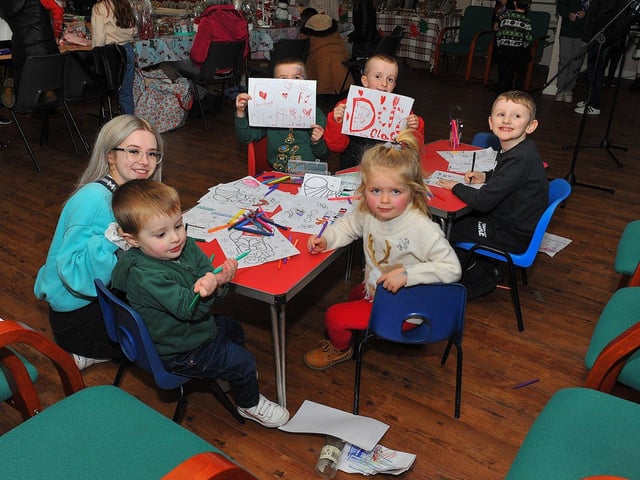Children enjoy the fun at the Galliagh Community Response Christmas Craft Fair held in Pio House Parish Centre on Saturday, in aid of Foyle Down Syndrome Trust. Photo: George Sweeney. DER2250GS – 83