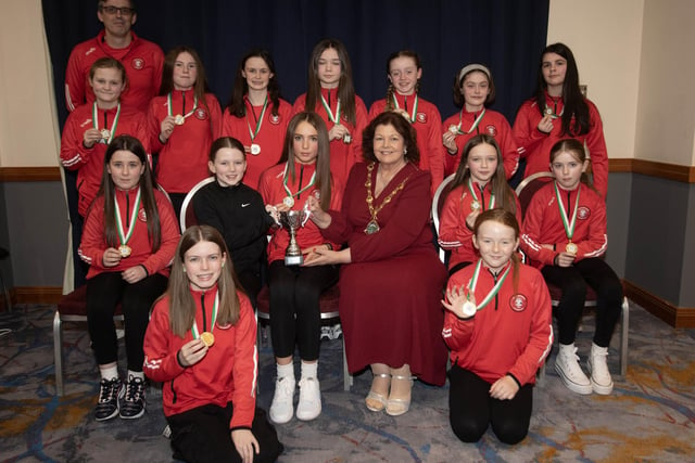 The Mayor of Derry City and Strabane District Council, Patricia Logue presenting the u-12 Summer Cup to winners Tristar Girls at Saturday night's D&D FA Ladies Football awards in the City Hotel. Included is manager Mark Wade. (Photos: Jim McCafferty Photography)