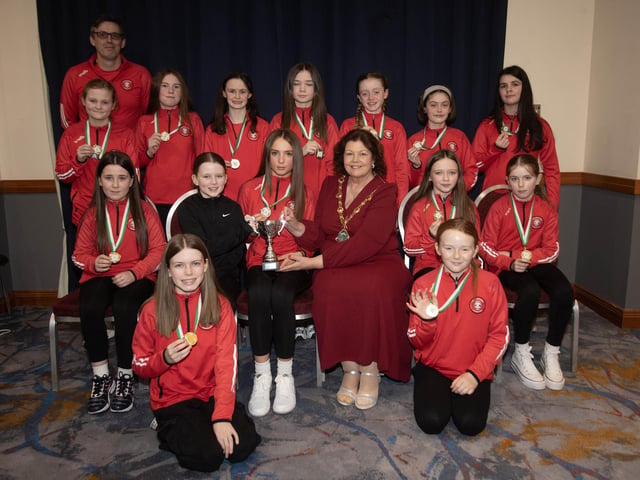 The Mayor of Derry City and Strabane District Council, Patricia Logue presenting the u-12 Summer Cup to winners Tristar Girls at Saturday night's D&D FA Ladies Football awards in the City Hotel. Included is manager Mark Wade. (Photos: Jim McCafferty Photography)