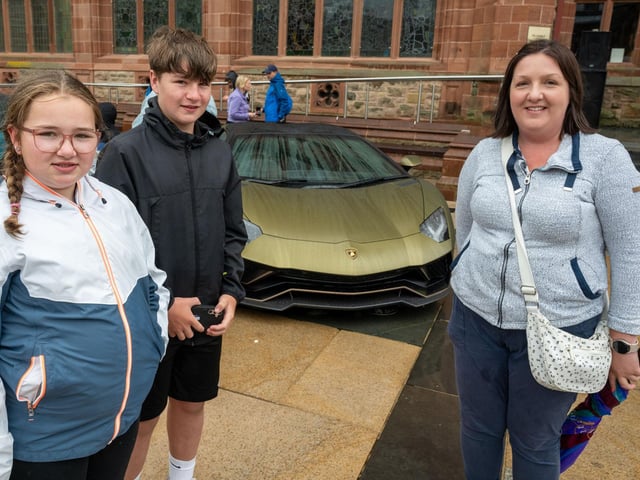 Esme and Tobias with Kirsty Walker, Bangor. Derry City and Strabane District Council Mayor, Councillor Lilian Seenoi-Barr has hosted Supercar Saturday in Guildhall Square to raise money for the Mayoral Charity Bud Club. The event attracted car enthusiasts and owners from across the region to support aid the local charity. Picture Martin McKeown. 24.05.25