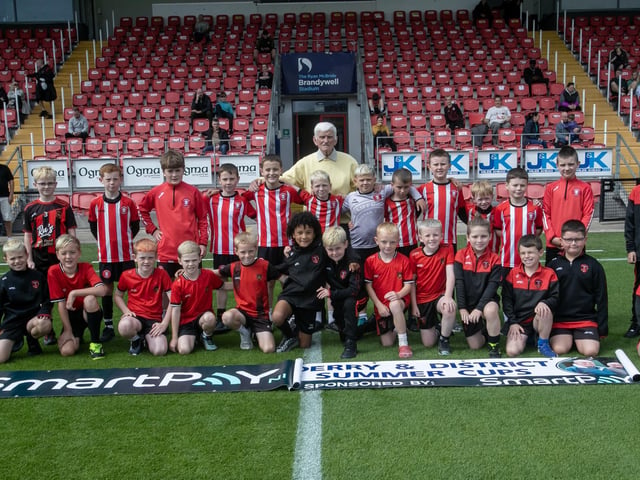 John 'Jobby' Crossan pictured with the ballboys at Saturday's final in the Brandywell. (Photos: Jim McCafferty Photography)
