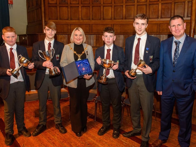 The Mayor Councillor Sandra Duffy welcomed pupils from Lisneal College to the Guildhall as she recognised the hugely successful cricket teams who claimed four trophies last season including the, U15 Ulster Schools Cup,Under 14 Derriaghy Cup, U13 Slemish Cup, U12 Wesley Ferris Cup. Pictured with Head Coach Chris Wilson are team captains, Charlie Neely U13, Jack McIvor U14, Adam Allen U12, and Charlie Downey U15. Picture Martin McKeown. 26.01.23:.