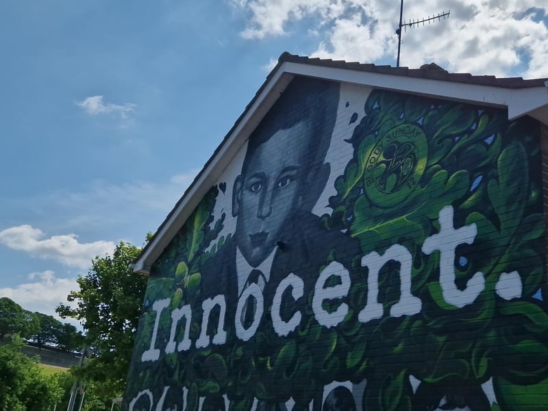 An image of Gerald Donaghey, aged 17, when he was shot dead features at the top of the mural.