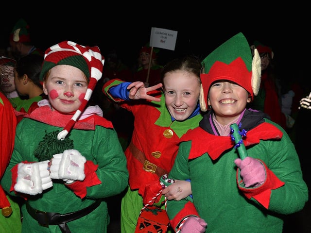 Culmore Community Partnership Elf Parade makes its way towards the Community Hub on Friday night. Photo: George Sweeney
