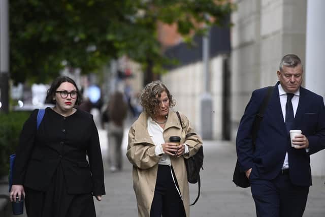 Fiona Donohoe (centre), the mother of 14-year-old Noah Donohoe, arriving at Belfast Coroner's Court, where the inquest into the death of her son, who was found dead in a storm drain in north Belfast in June 2020, six days after he went missing while cycling to meet friends, is taking place. Picture date: Monday September 14, 2026.