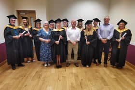 The graduation party with their tutors Patricia Clarke and Richard McFadden. Centre is Tommy McAuley, Acting Head of Sign Language Policy and Legislation with the Department for Communities.