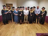 The graduation party with their tutors Patricia Clarke and Richard McFadden. Centre is Tommy McAuley, Acting Head of Sign Language Policy and Legislation with the Department for Communities.
