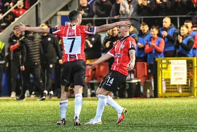 Michael Duffy (7) celebrates scoring Derry City's second goal, against Shamrock Rovers, with Ben Doherty. Photo: George Sweeney