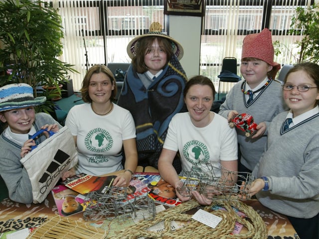 Thornhill College teachers Sue Gallagher and Catherine Montgomery, pictured with pupils Naimh McGuire, Katrina Sharkey, Jacqui Condren and Christina McDevitt at an exhibition being held in the school this week in which they are showcasing some of the work they collected from a 'Global Teacher Exchange' in South Africa this Summer. (1410JB81):Derry and Donegal secondary school pupils in October 2003