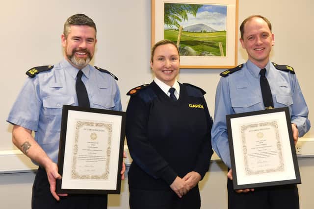 Gda. Damien Welby (left) and Gda. Alan Lynch (right) pictured after receiving their Scott Medal Commendation 1st Class from Deputy Commissioner Shawna Cox. Photo: Ken Finegan/www.newspics.ie