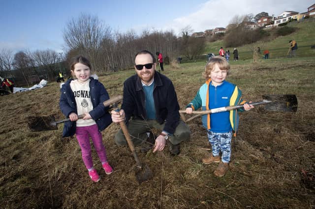 Dad Jonathan Crockett pictured with Nora (6) and Seamus (4) during Saturday's Special Tree Planting at Bay Road.