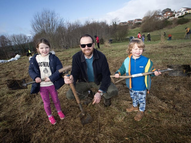 Dad Jonathan Crockett pictured with Nora (6) and Seamus (4) during Saturday's Special Tree Planting at Bay Road.