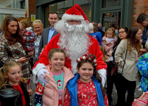 Children and parents gather at Foyleside Shopping Centre on Saturday morning to greet Santa. Photo: George Sweeney.  DER2244GS – 67