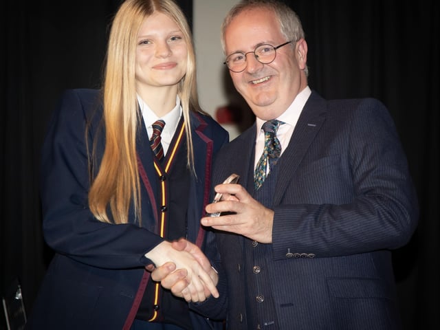 Evie Birch receiving the Rugby Award from Principal, Mr. John Harkin.
