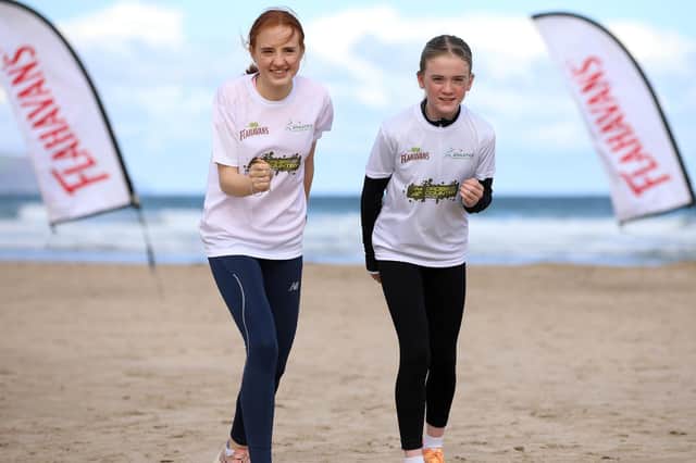 Local pupil Bonnie Devlin from St. Anne’s Primary School, Derry with Flahavan’s Primary School Cross Country League Ambassador, Hannah Gilliland, at the 2023-2024 launch in Portstewart.