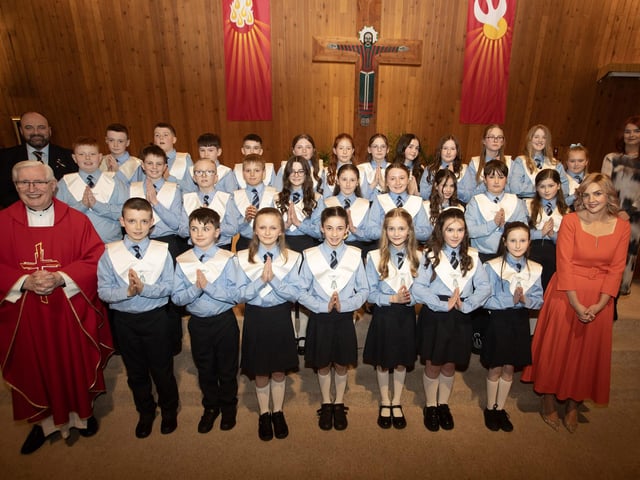HOLLYBUSH PS CONFIRMATION . . . . .Pupils from Ms. Sutherland's P7 class at Hollybush Primary School who received the Sacrament of Confirmation from Fr. Colum Clerkin at Our Lady of Lourdes Church, Steelstown on Wednesday afternoon last. Included is Mr. Feargal Friel, Principal and Ms. Danielle Kelly, Classroom Assistant. (Photos: Jim McCafferty Photography)